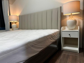 A King-size bed at Air Residences Condo, Ayala Ave, Makati